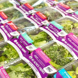 Packages of 80 Acres Farms lettuce